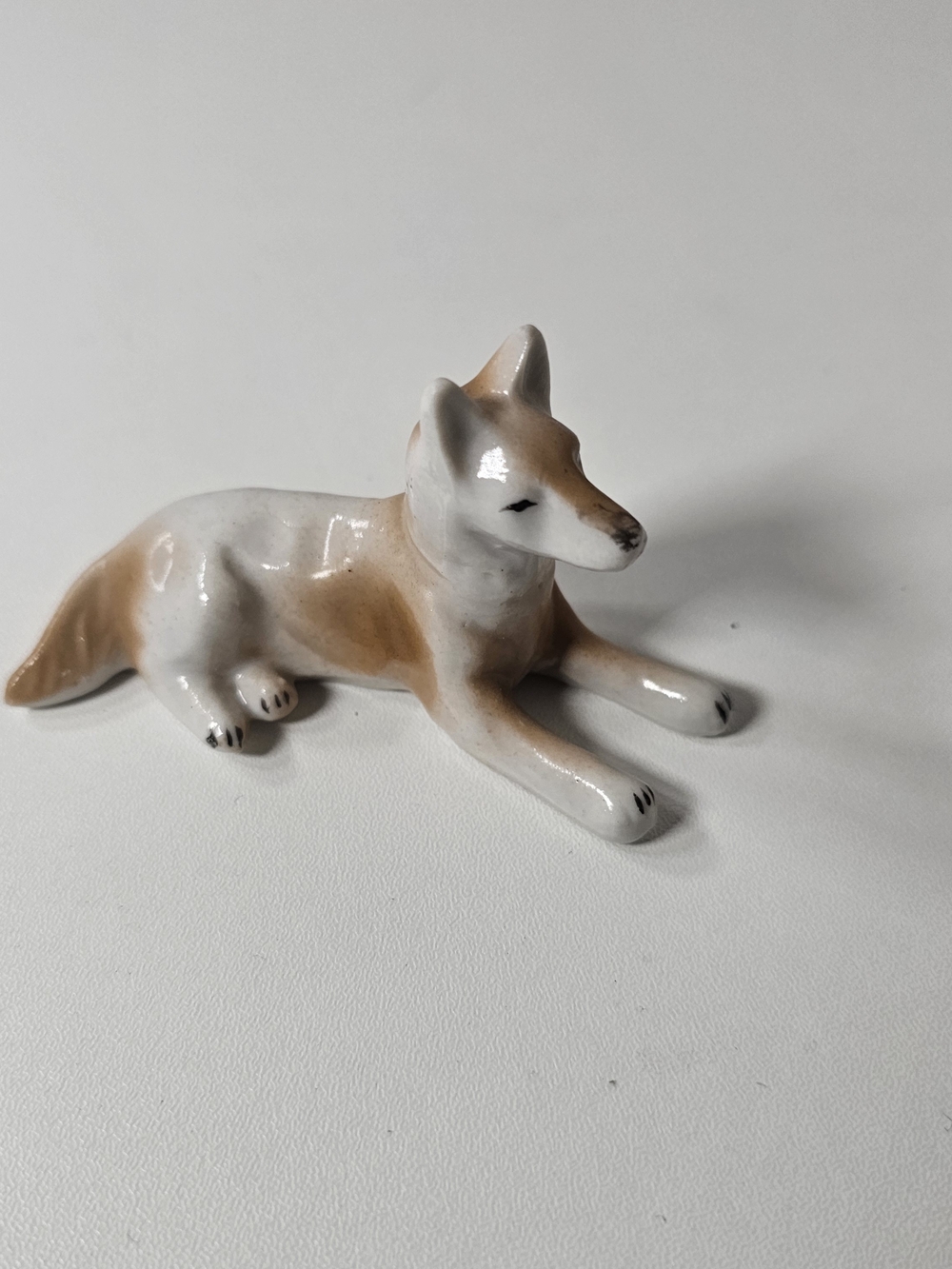 Porcelain Lying Fox Figurine in White and Tan